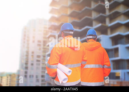 Two engineers looking at consrtuction site Stock Photo