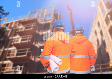 Two engineers looking at consrtuction site Stock Photo