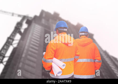 Two engineers looking at consrtuction site Stock Photo