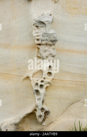 Abstract eroded weathered Beige Rock formation background Stock Photo