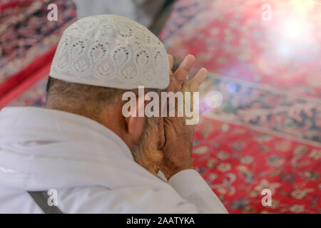 Old Muslim man praying Stock Photo