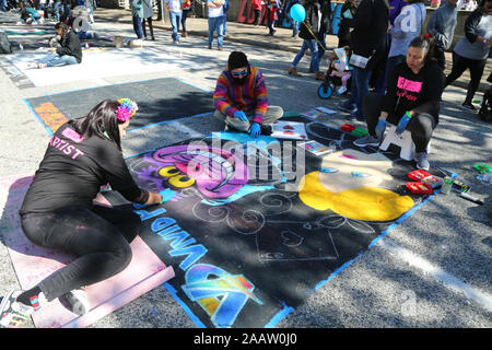 Houston, USA. 23rd Nov, 2019. Artists draw street paintings in Houston, Texas, the United States, on Nov. 23, 2019. More than 200 artists took part in this year's Houston Via Colori, one of the largest art festivals in the city, which is held to raise money for hearing-impaired children. Credit: Qiu Ma/Xinhua/Alamy Live News Stock Photo