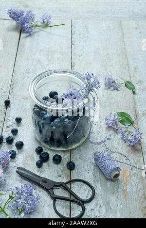 High angle view of blueberries in jar on wooden table Stock Photo