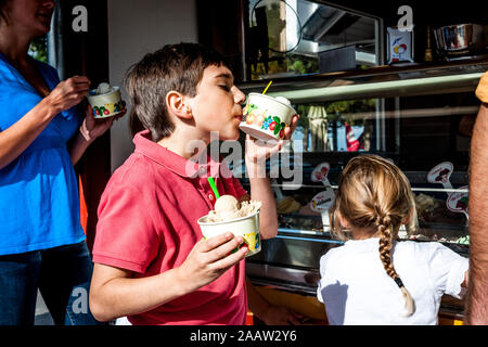 Family having ice cream at an ice cream parlor Stock Photo