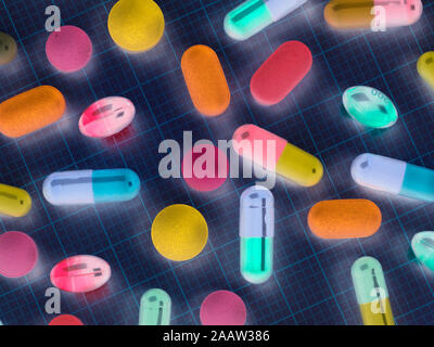 High angle view of various medicines on graph paper Stock Photo