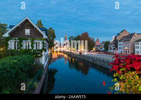 River ill along with buildings against sky at dusk, Strasbourg, France Stock Photo