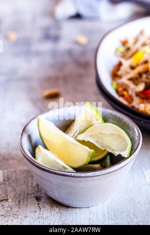 Lime pieces in bowl Stock Photo