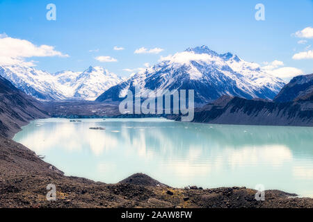 New Zealand, South Island, Scenic view of Tasman Lake and snowcapped mountains Stock Photo