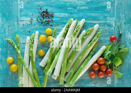 Directly above shot of various raw vegetables with spices on wooden table Stock Photo