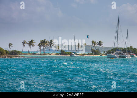 Sailboats anchored at Saline Bay against sky, Mayreau, Tobago Cays, Grenadines islands, St. Vincent and the Grenadines, Caribbean Stock Photo