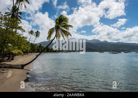 Scenic view of sea and mountains against cloudy sky, Dominica, Caribbean Stock Photo