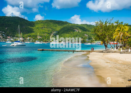 Scenic view of town beach at Port Elizabeth, Admiralty Bay, Bequia, St. Vincent and the Grenadines, Caribbean Stock Photo
