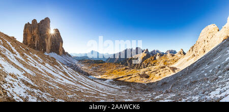 Panoramic view of Tre Cime di Lavaredo against clear blue sky during winter, Italy Stock Photo