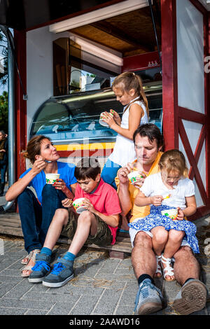 Family having ice cream at an ice cream parlor Stock Photo