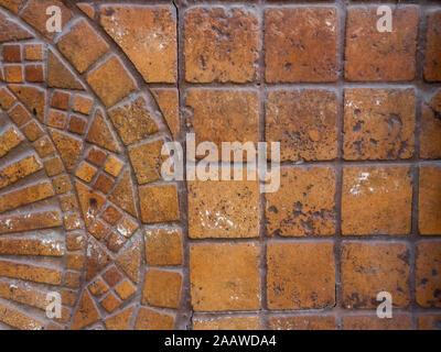 Fragment of brown textured pedestrian cobblestone pavement with pattern in old turkish town Stock Photo