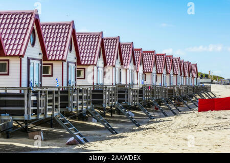 Netherlands, Zeeland, Domburg, row of wooden houses on sandy beach Stock Photo