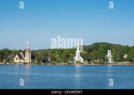 Canada, Nova Scotia, Lunenburg County, Mahone Bay, view across bay with three churches United Mahone Bay Church, St Johns Lutheran Church and St James Anglican Church Stock Photo