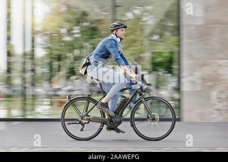 Student on his e-bike at Goethe University in Frankfurt, Germany Stock Photo