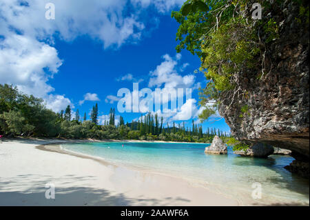 Scenic view of white sand beach against sky, Ile Des Pins, New Caledonia Stock Photo