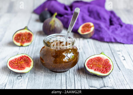 Sliced figs and jar of homemade fig jam Stock Photo