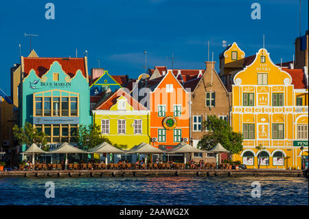 Houses by Sint Annabaai against blue sky in Willemstad city during sunny day, Curaçao Stock Photo