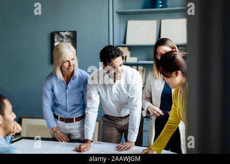 Architects having a meeting, discussing a project Stock Photo