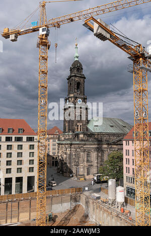 High angle view of cranes and Kreuzkirche against cloudy sky in city, Saxony, Germany Stock Photo