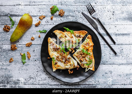 Directly above shot of pizza slices served in plate on table Stock Photo