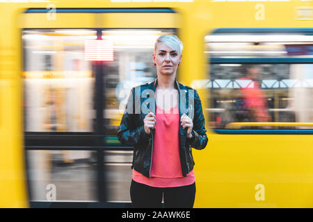 Portrait of woman standing at platform, Berlin, Germany Stock Photo