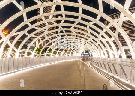 Illuminated Webb Bridge in Docklands at night, Melbourne, Australia Stock Photo