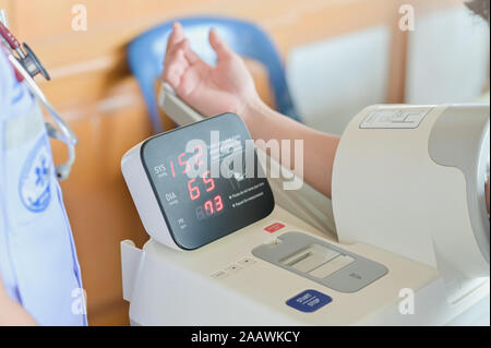 Blood pressure gauge show Hypertension or High Blood Pressure checking blood pressure of the patient in hospital, selective focus Stock Photo