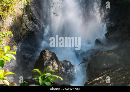 View of Trafalgar Falls splashing on rocks in Morne Trois Pitons National Park, Dominica Stock Photo