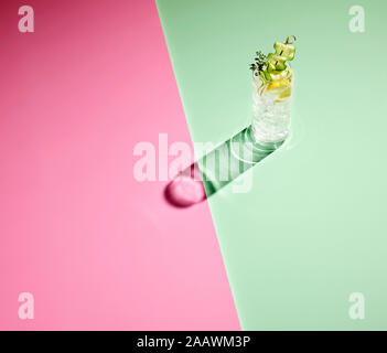 High angle view of gin on colored background Stock Photo
