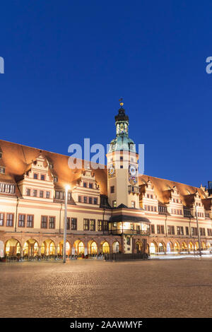 Low angle view of Town Hall Tower against clear blue sky in Leipzig at dusk, Germany Stock Photo