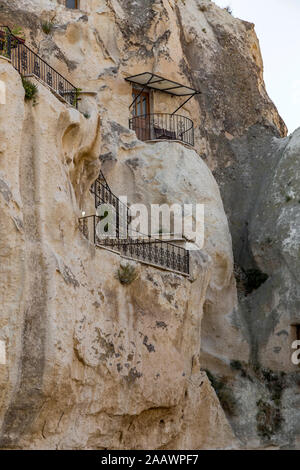 Low angle view of houses in rock formation, Cappadocia Stock Photo
