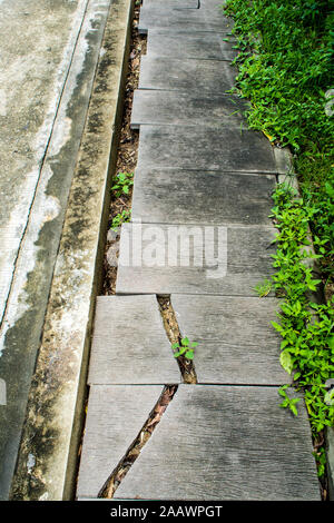 The footpath beside road was abandoned to and cluttered Stock Photo