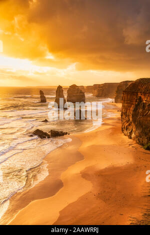 Stack rocks against cloudy sky at Twelve Apostles Marine National Park, Victoria, Australia Stock Photo