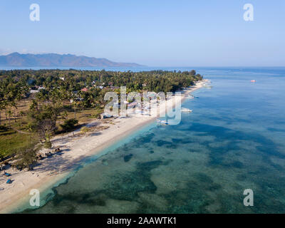 Drone shot of Gili islands against clear blue sky at Bali, Indonesia Stock Photo