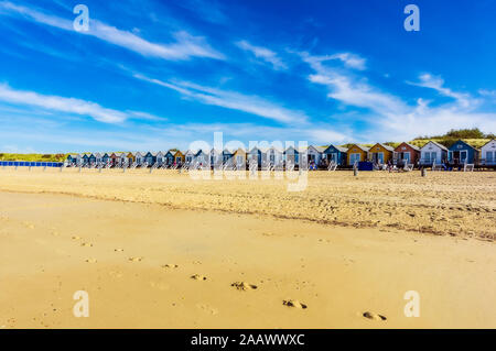 Netherlands, Zeeland, Vlissingen, row of wooden houses on sandy beach Stock Photo