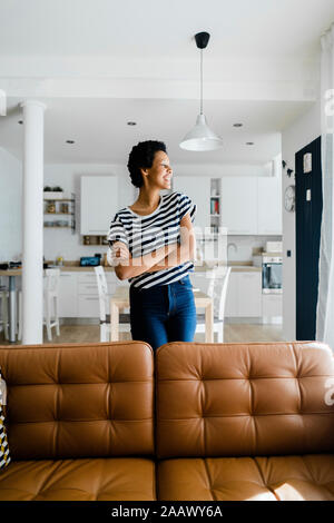 Happy young woman at home Stock Photo