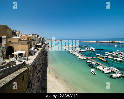 Italy, Province of Lecce, Otranto, Various motorboats moored in harbor of coastal town Stock Photo