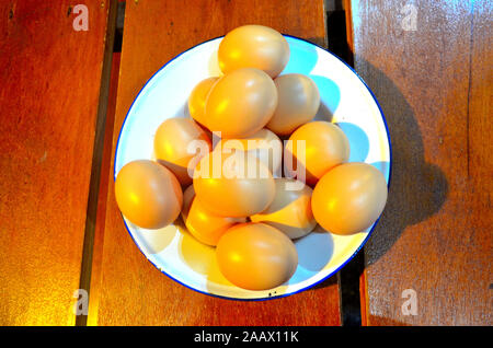 A bowl of fresh eggs in a bowl on a wooken table at Phuket Mining Museum Kathu Phuket Thailand Asia Stock Photo