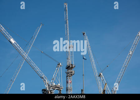 Cranes above construction site in central Edinburgh Stock Photo