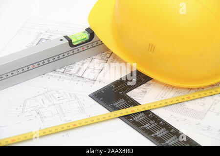 Photo of the Helmet and tools for construction drawings and buildings Stock Photo