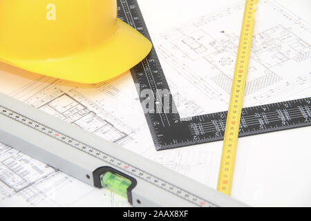 Photo of the Helmet and tools for construction drawings and buildings Stock Photo