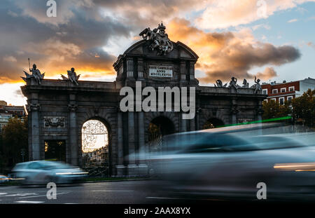 Puerta de Alcala, Gate or Citadel Gate is a Neo-classical monument in the Plaza de la Independencia in Madrid, Spain - long exposure deliberate motion Stock Photo