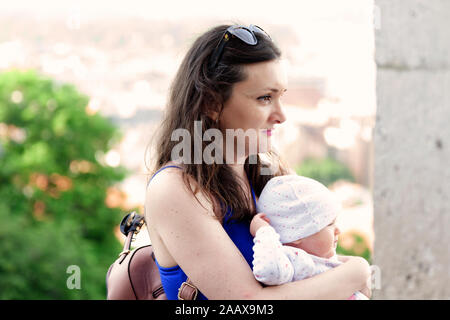 Budapest, Hungary - May 28, 2019: Mom and infant look out over the city Stock Photo