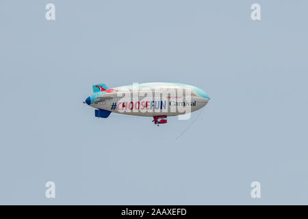 Airship. An airship over Philadelphia, styled as a cruise liner, advertising the Carnival cruise line. Stock Photo