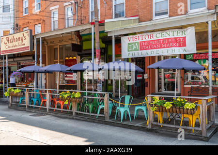 Colourful chairs for al fresco dining in Philadelphia's Italian Market on South 9th St. Stock Photo