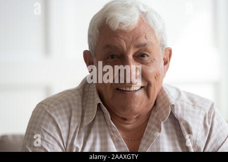Headshot closeup portrait of happy mature grey-haired man. Stock Photo